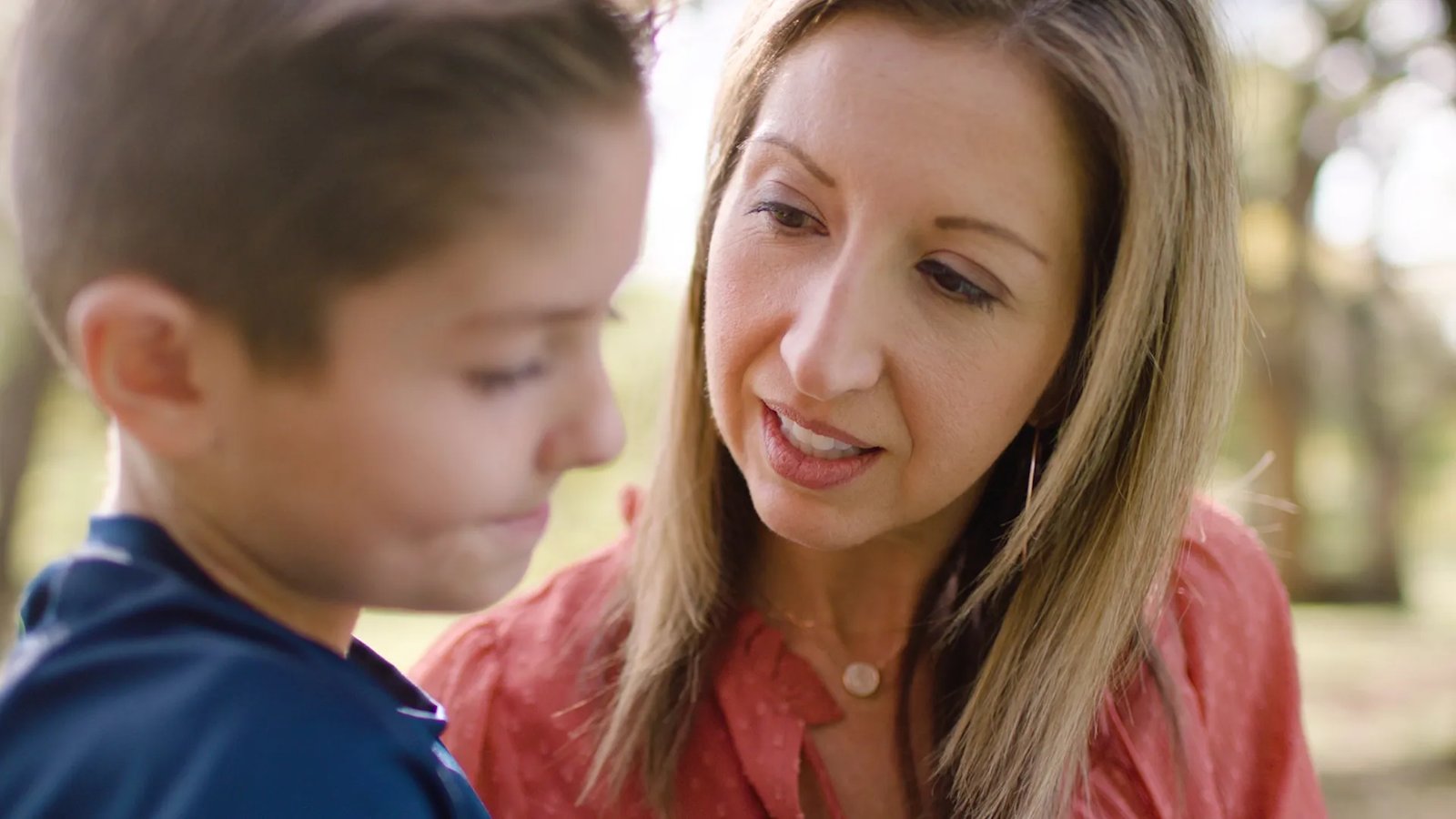 A mother looks at her son.