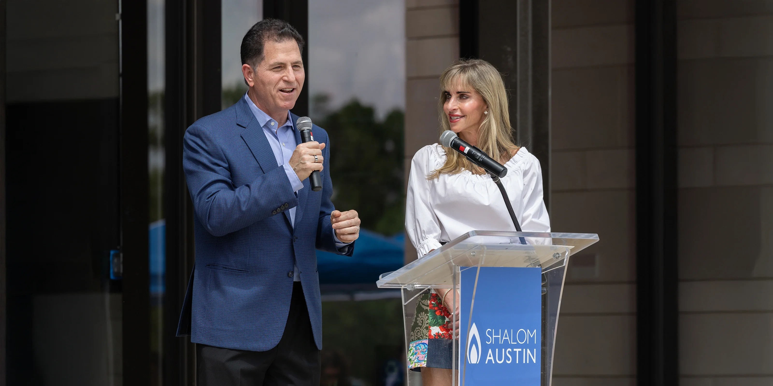 Michael and Susan Dell speak at the Ribbon Cutting ceremony commemorating the expanded Dell JCC in May of 2023.