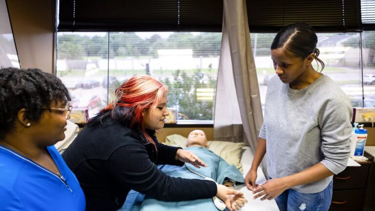 Three trainees participate in the Memorial Assistance Ministries (MAM) Nurse Assistance Training program in southwest Houston.