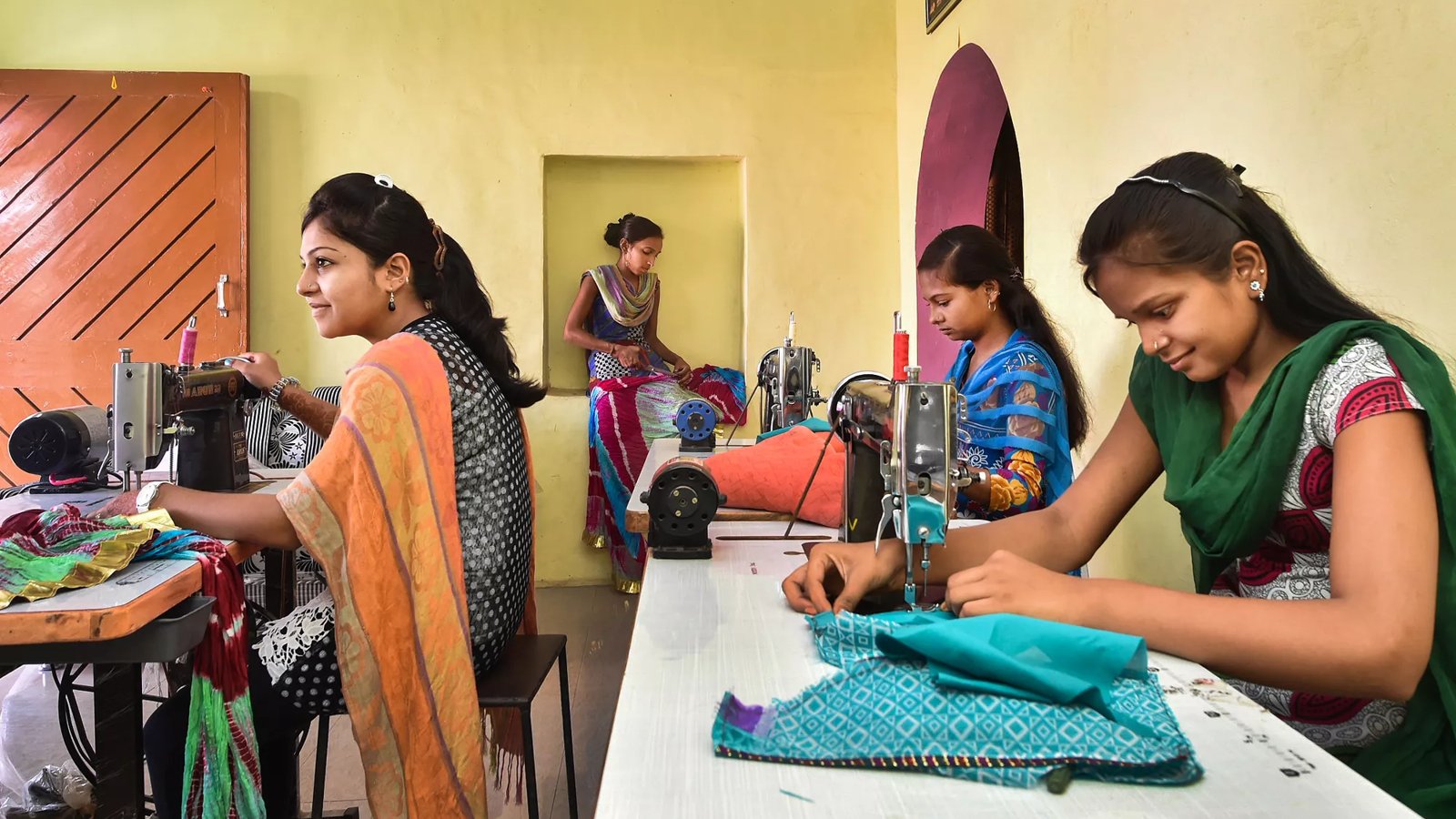 A group of Indian women in a clothing shop.