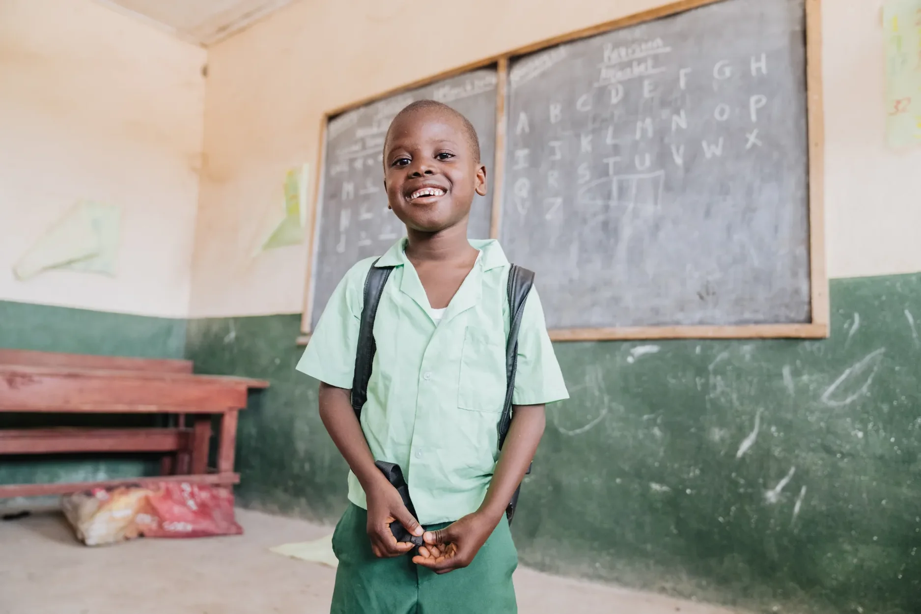 With new vision and restored independence, Mamadou now attends school confidently, plays with friends, and helps his mother with daily tasks.