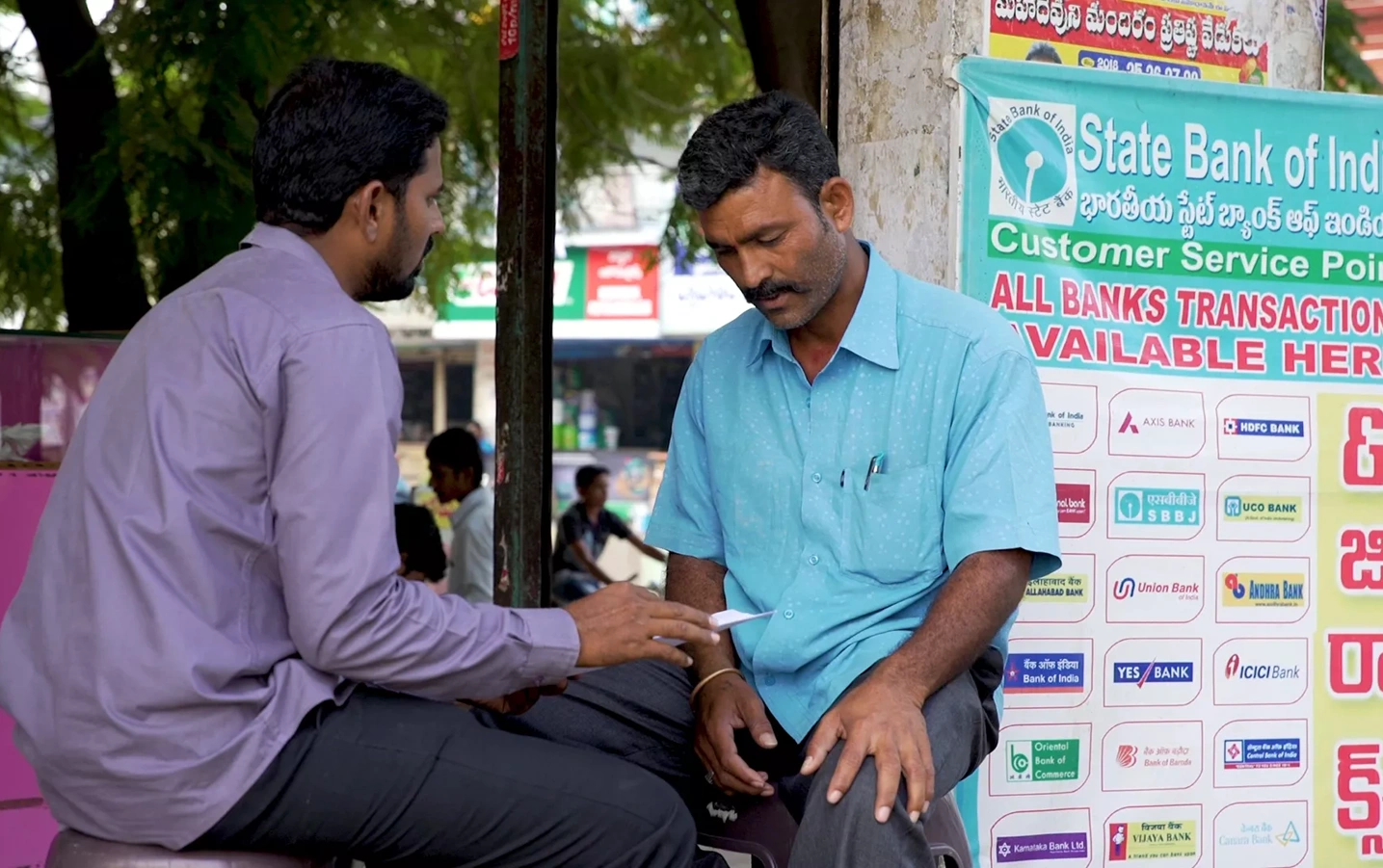 A banking customer talks with a banking rep.