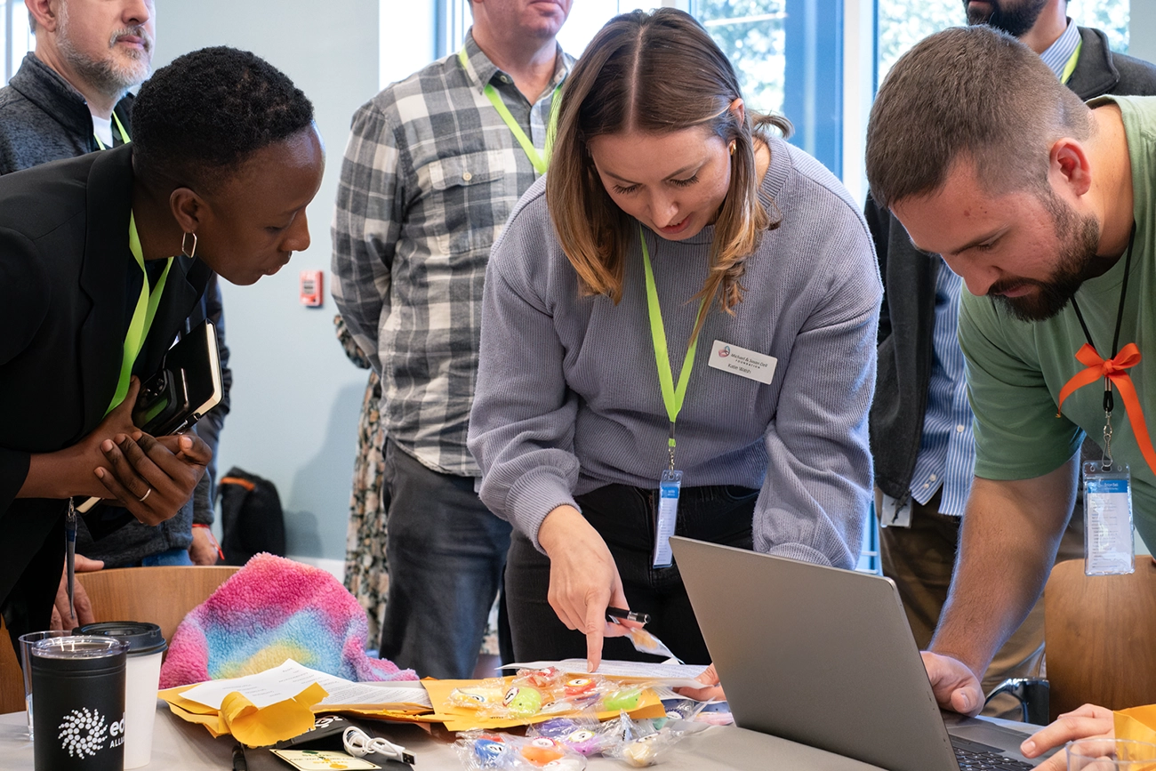 Dell Foundation staff members working on a project side-by-side.